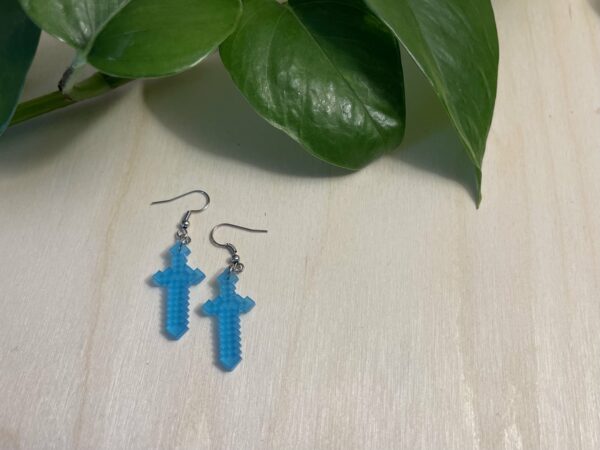 Acrylic blue diamond sword dangle earrings