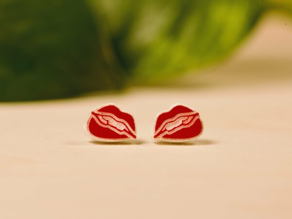 Red and white acrylic lip shaped stud earrings.