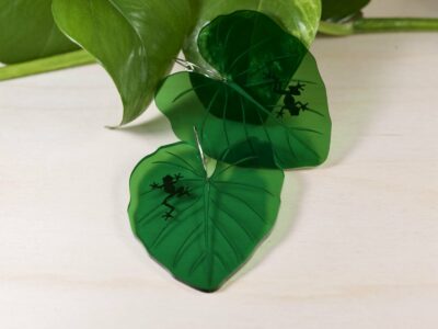 Frog silhouette large green leaf dangle earrings.